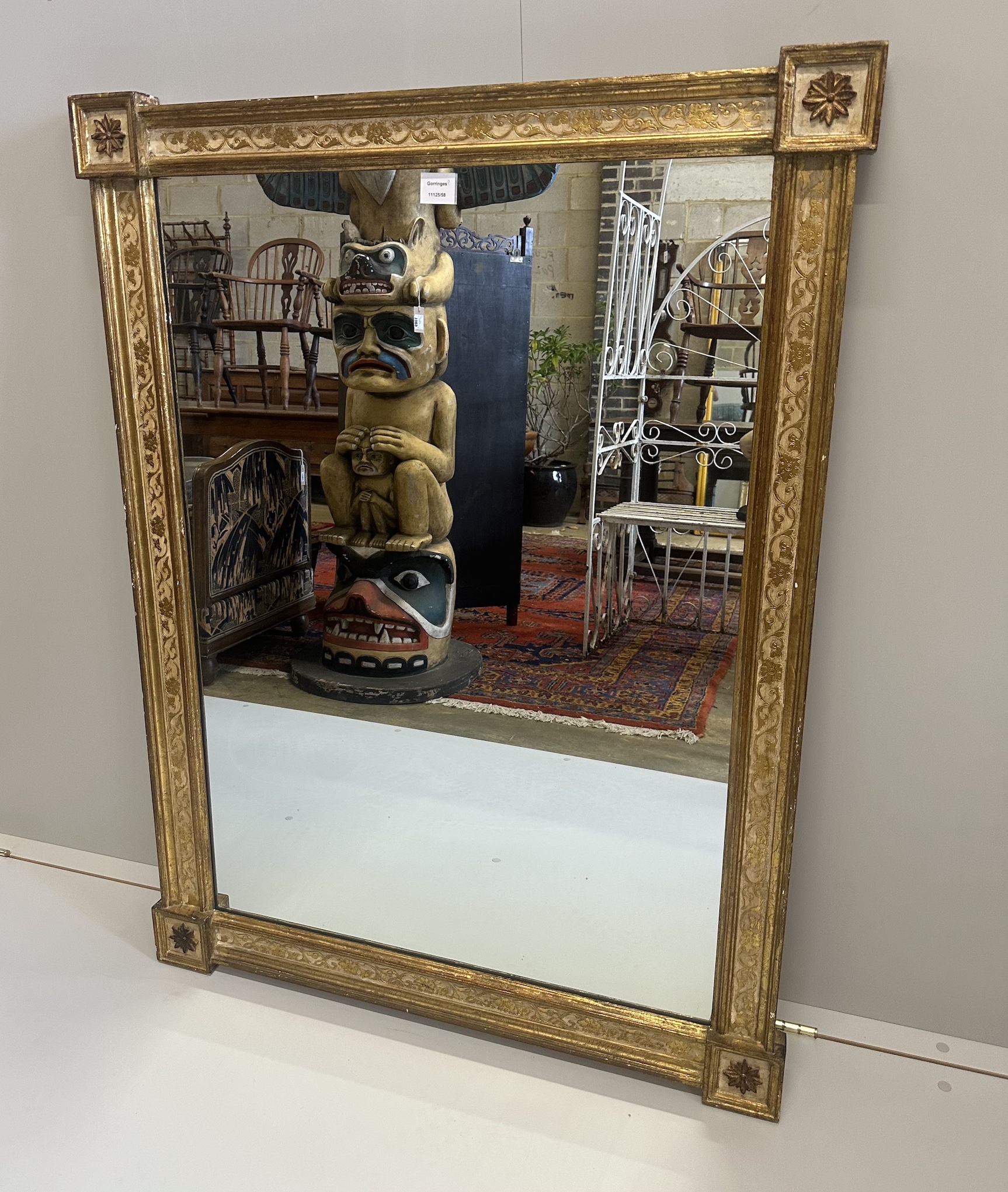 An early 19th century style giltwood rectangular overmantel, with cream and gilt foliate inset borders, width 90cm, height 120cm